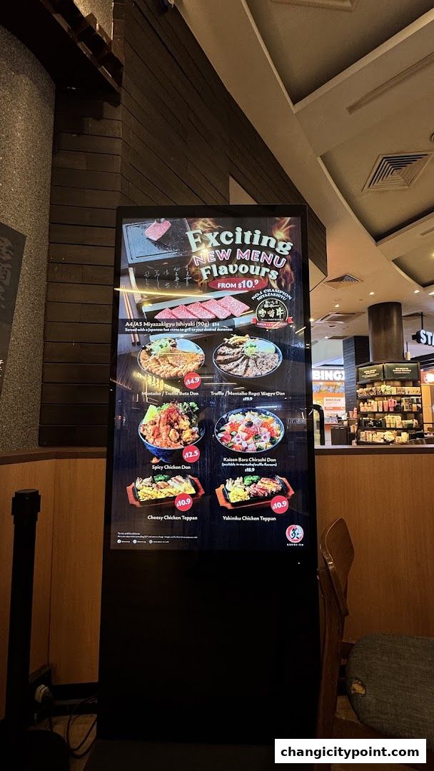 A digital menu board showcasing new menu items with enticing images and prices.
