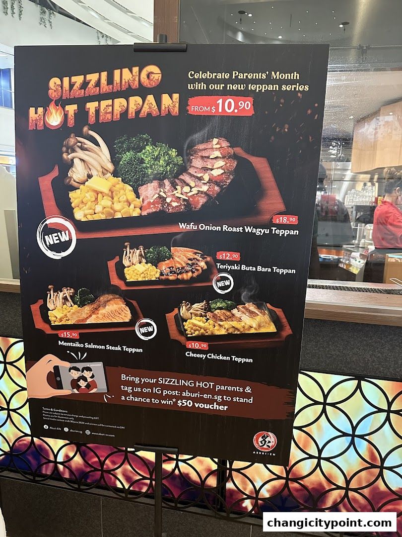 A menu board advertising Sizzling Hot Teppan dishes for Parents' Month.