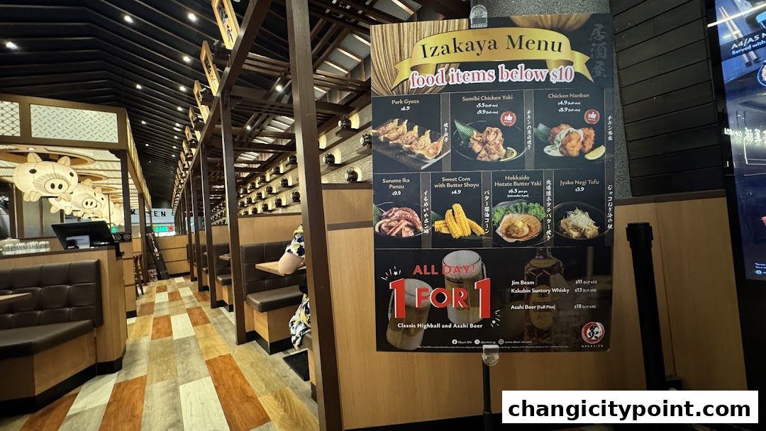 A menu board for Aburi-EN Changi City Point, featuring Japanese izakaya dishes and drinks.