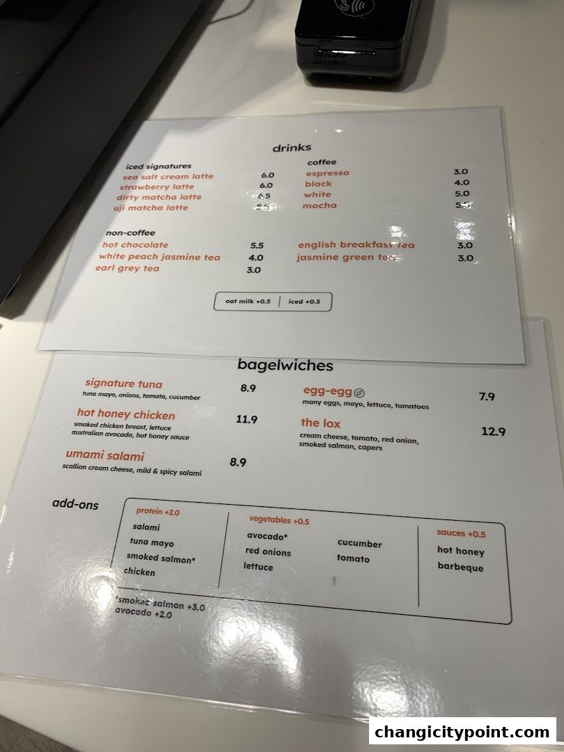 A menu for 'another bean' featuring drinks, bagelwiches, and add-ons.