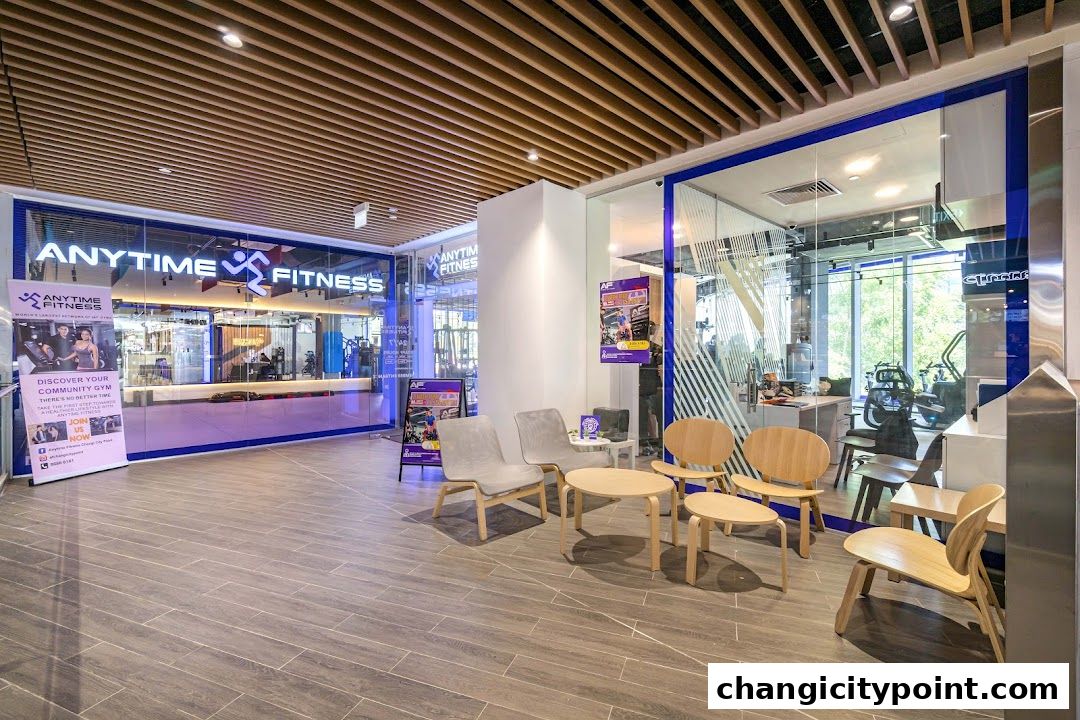 Interior view of Anytime Fitness Changi with gym equipment and a reception area.