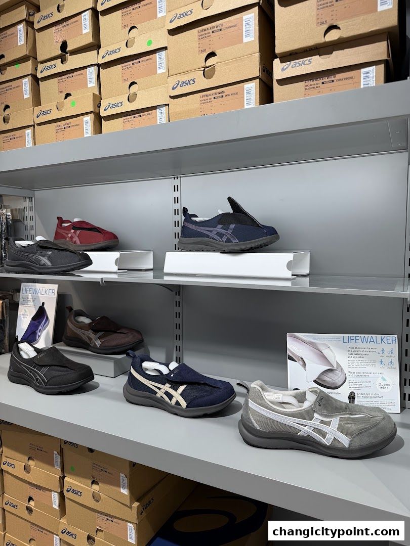 Shelves stocked with ASICS shoes and boxes, showcasing various footwear options.