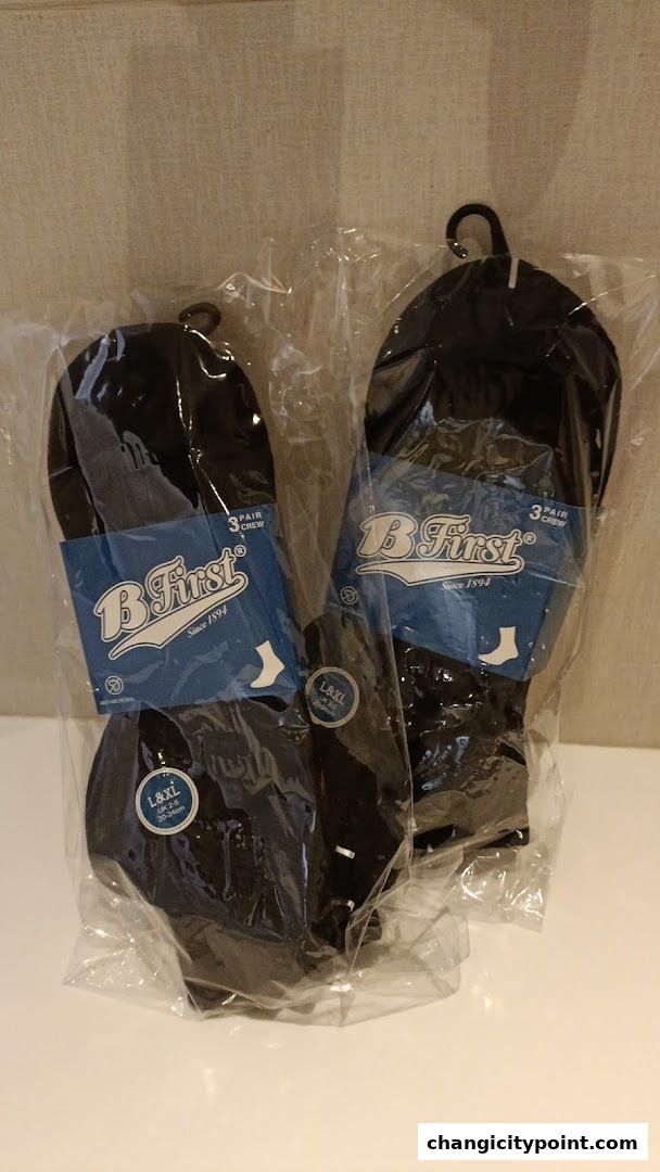 Packaged black crew socks from Bata, featuring the 'B First' brand.