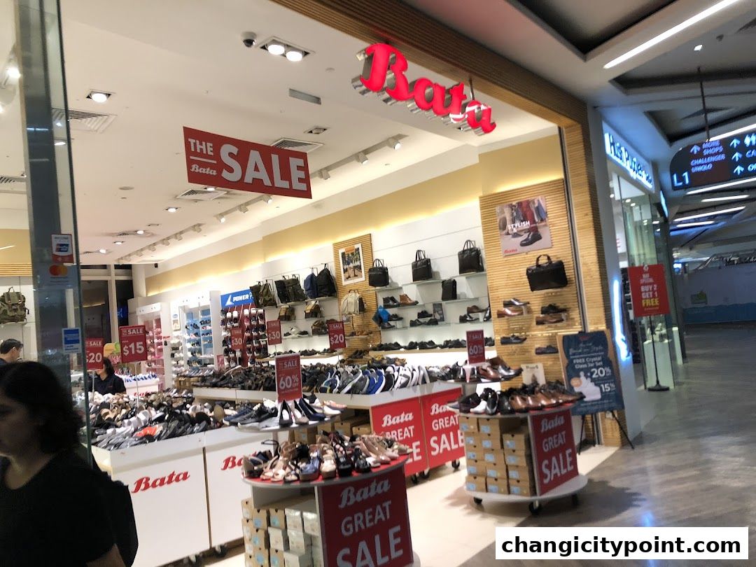 A Bata shoe store with a large sale display and various footwear options.