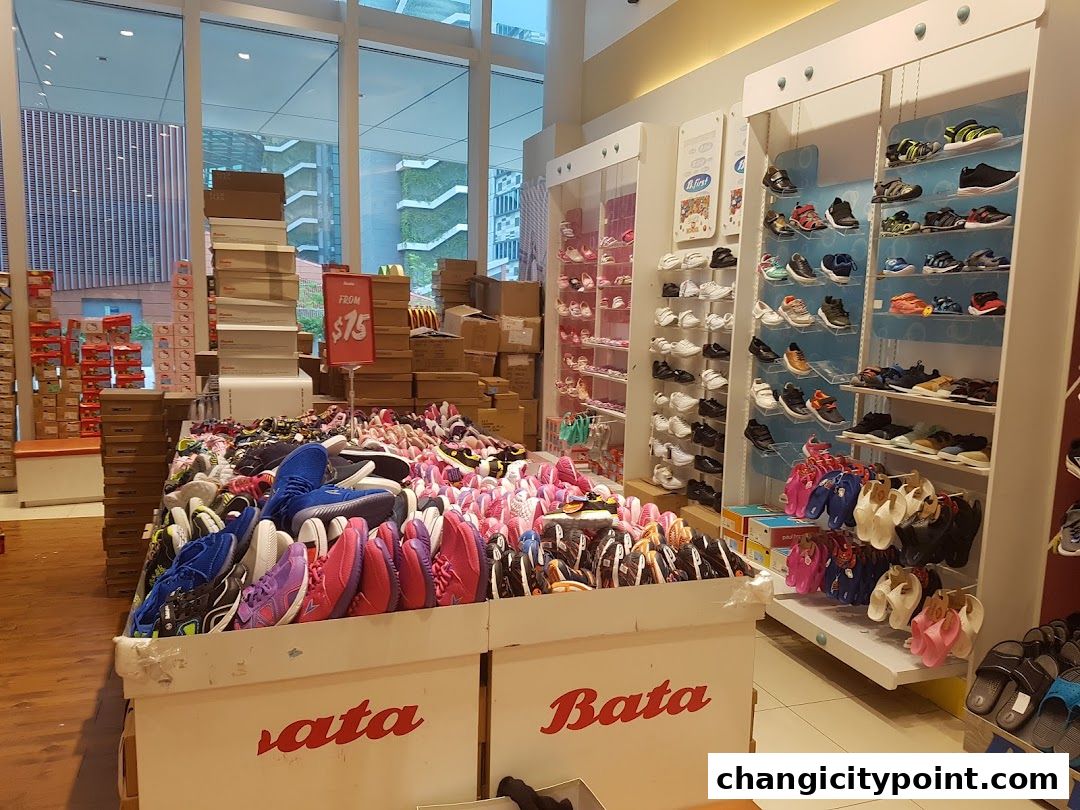 A Bata shoe store interior displaying a wide variety of footwear for sale.