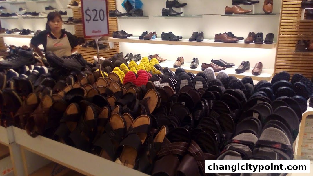 A wide selection of shoes and sandals are displayed in a Bata store.
