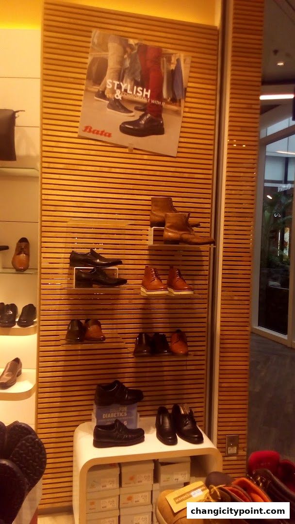 A Bata shoe store display featuring various men's and women's footwear on shelves.