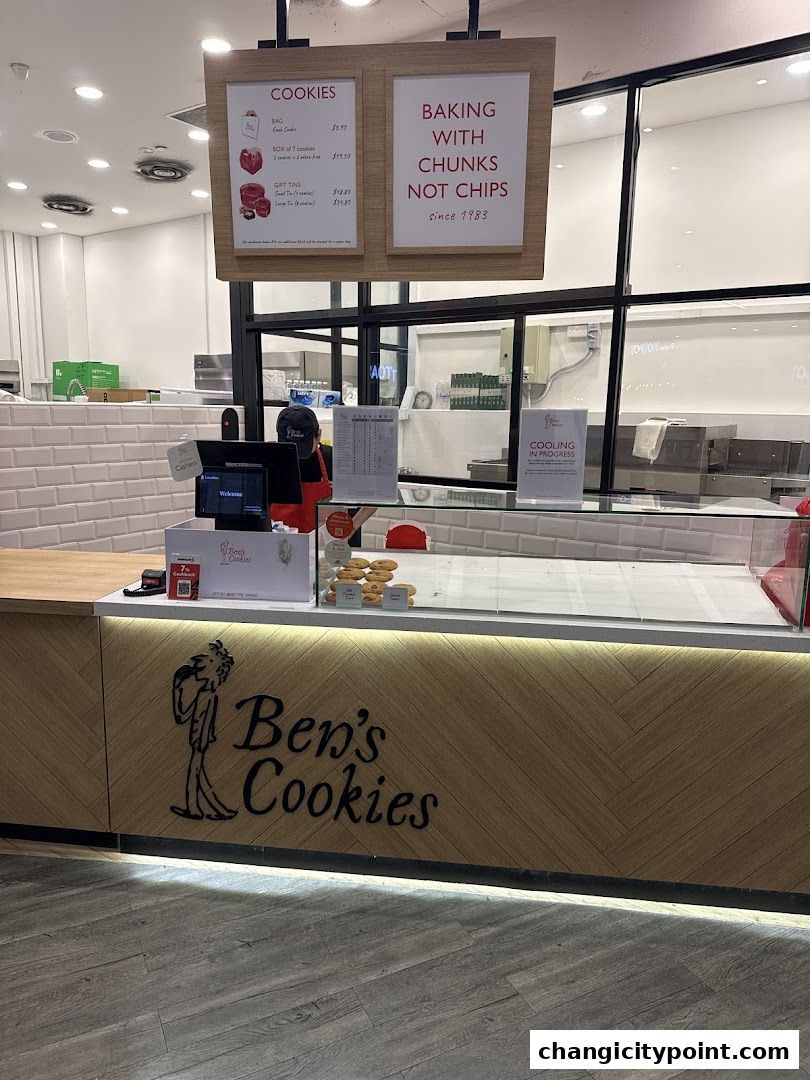 The front counter of Ben's Cookies shop with a menu and branding.