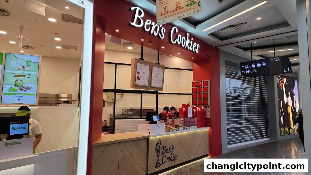 The exterior of Ben's Cookies shop with its signature red branding and display of cookies.