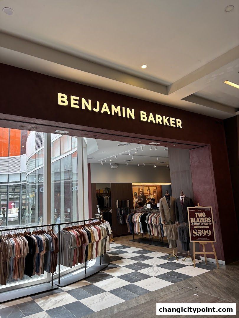 Benjamin Barker store entrance with clothing displays and a promotional sign.