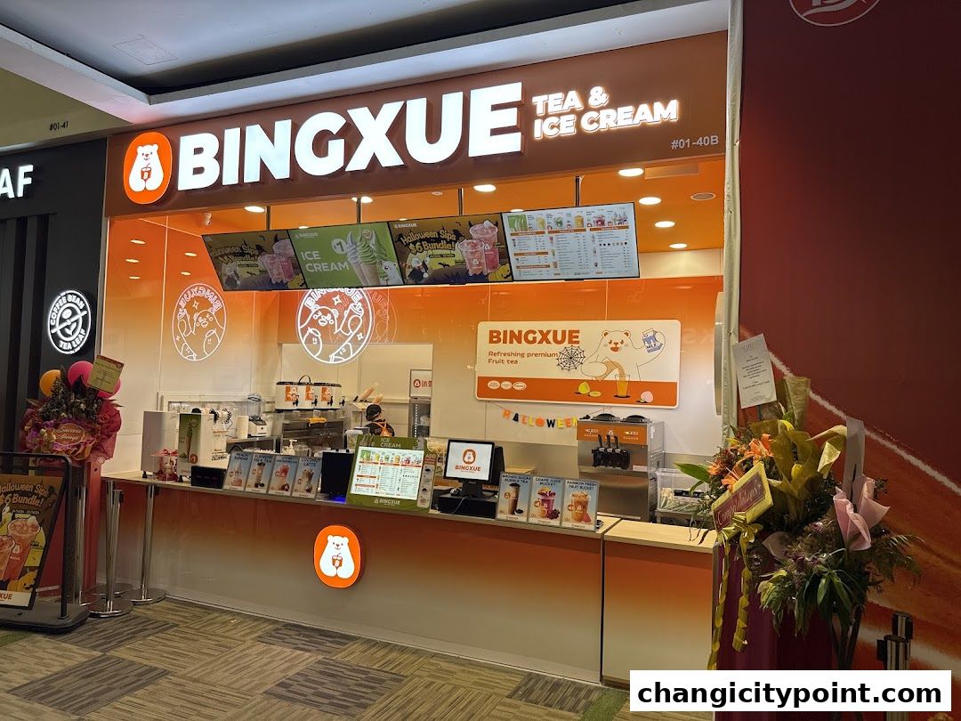 BingXue Tea & Ice Cream shop front with bright orange branding and menu displays.