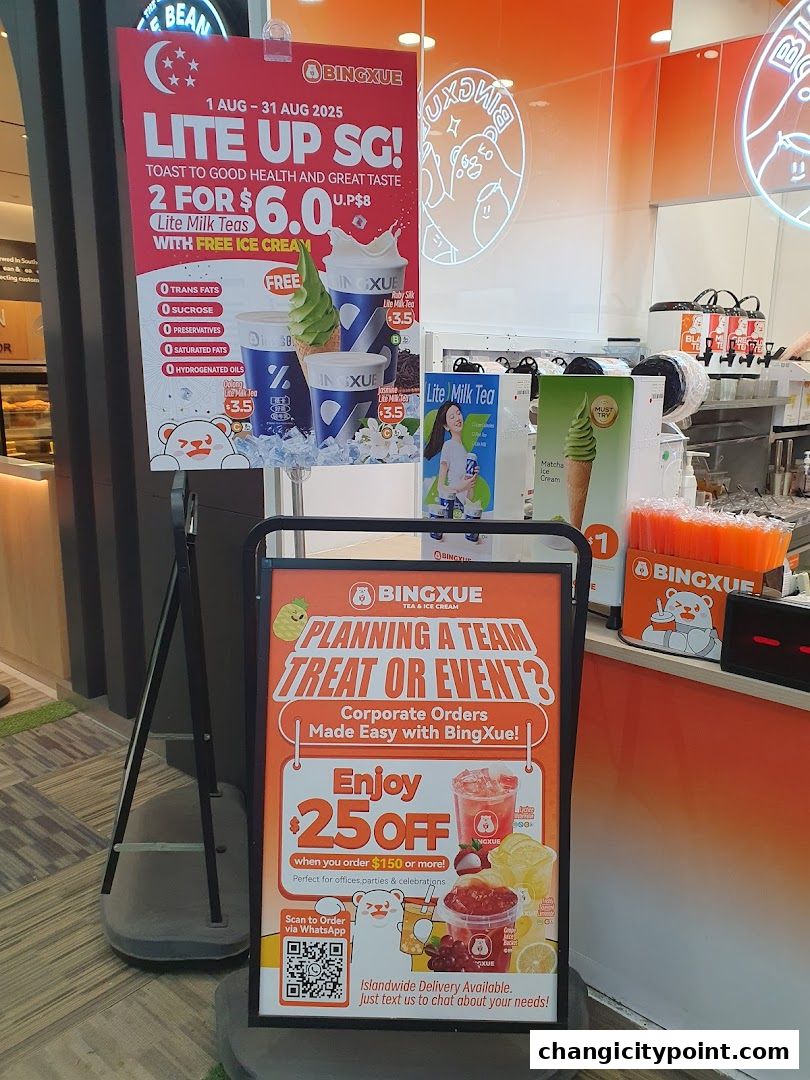 BingXue Tea & Ice Cream shop with promotional signs for milk teas and corporate orders.