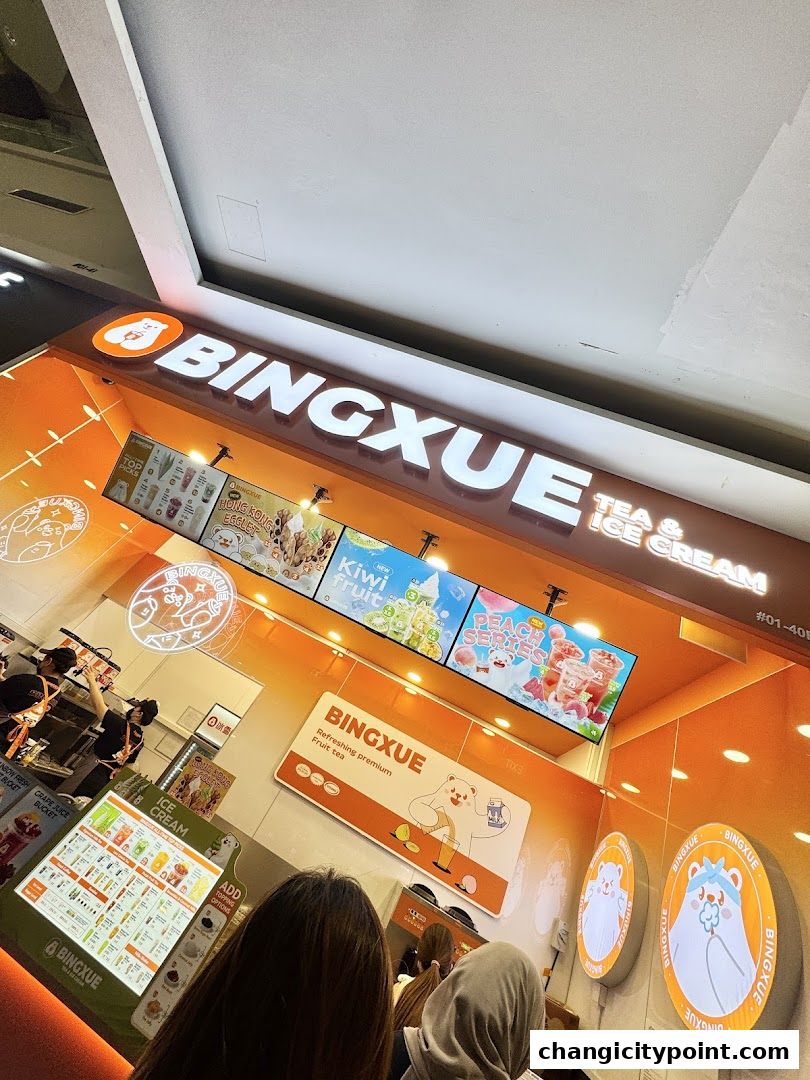 BingXue Tea & Ice Cream shop front with illuminated signage and menu displays.