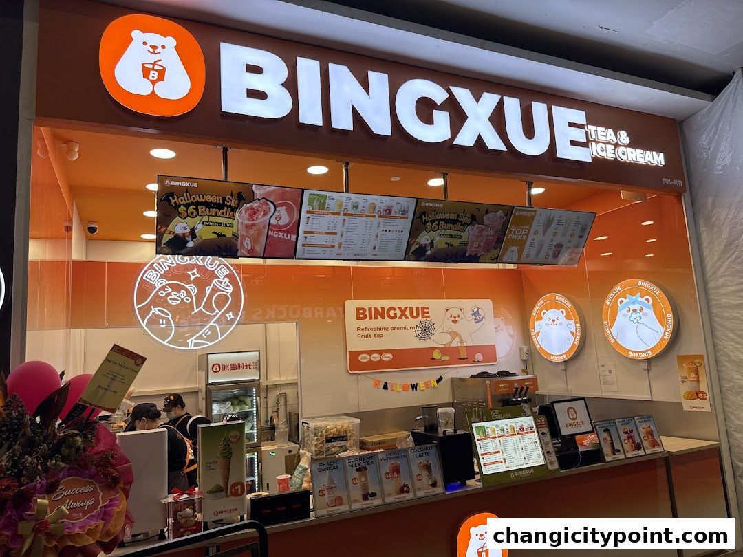 BingXue Tea & Ice Cream shop front with bright orange branding and menu displays.
