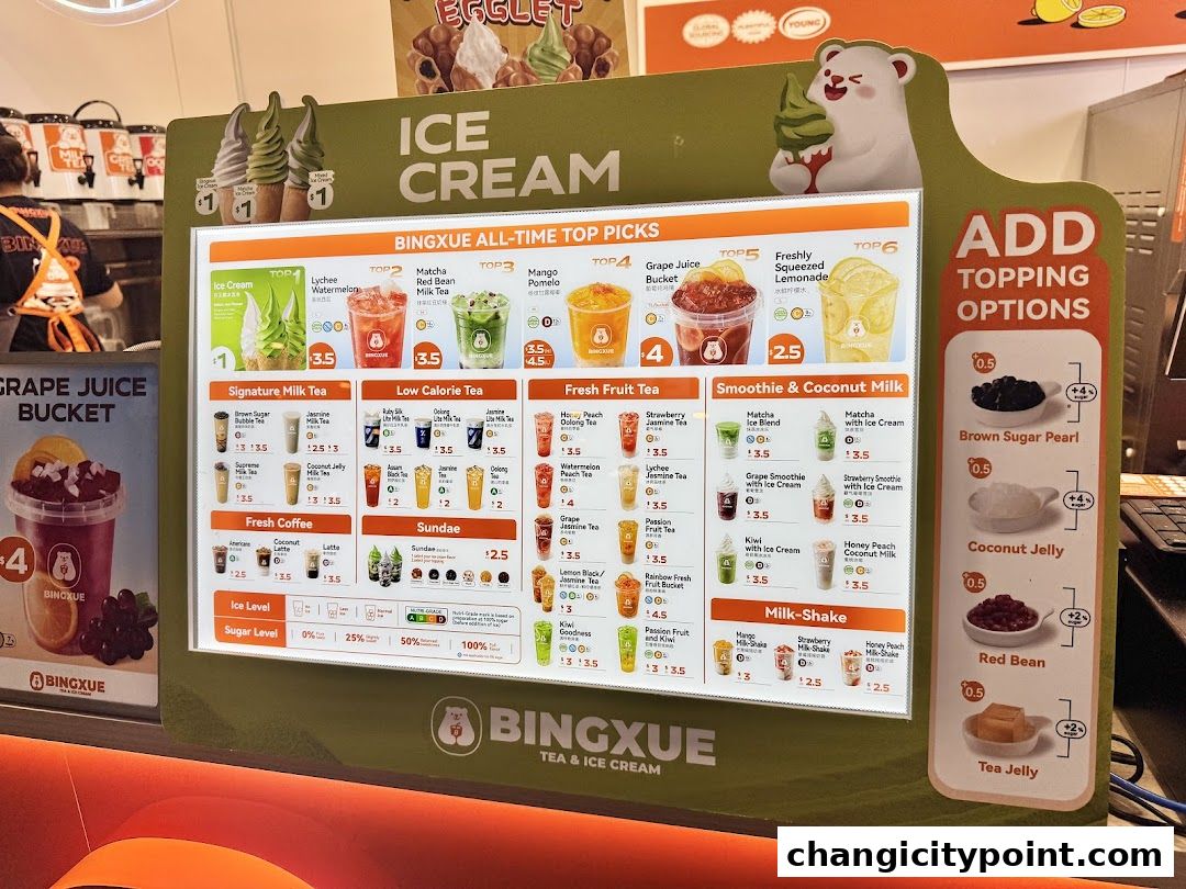 A digital menu board displaying ice cream, milk tea, and other beverages with prices.