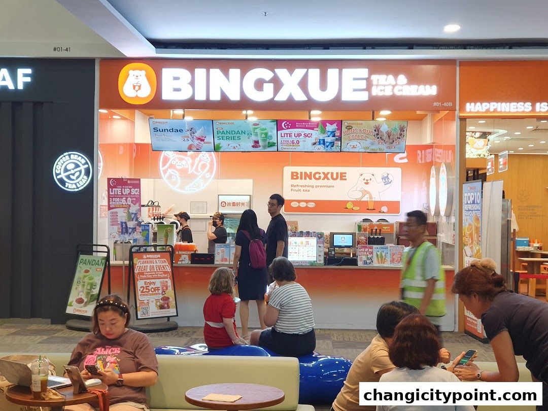 BingXue Tea & Ice Cream shop front with colorful displays and customers.