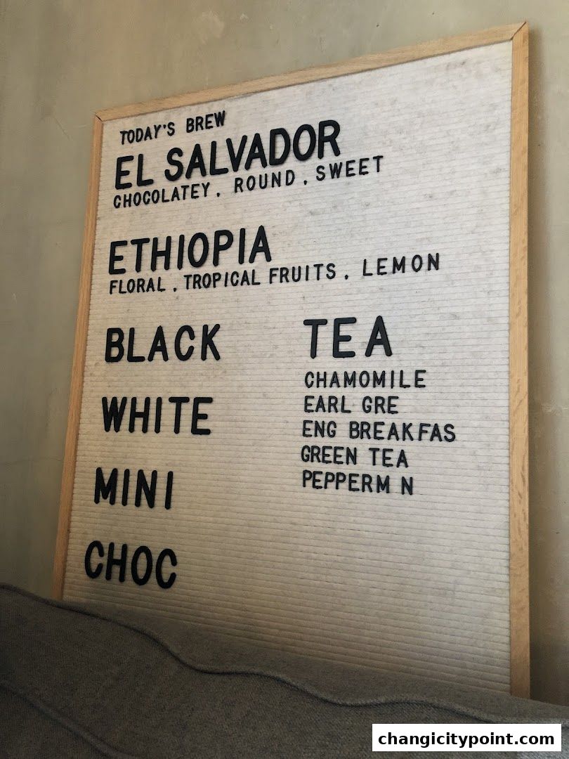 A felt letter board menu displaying coffee and tea options with descriptions.