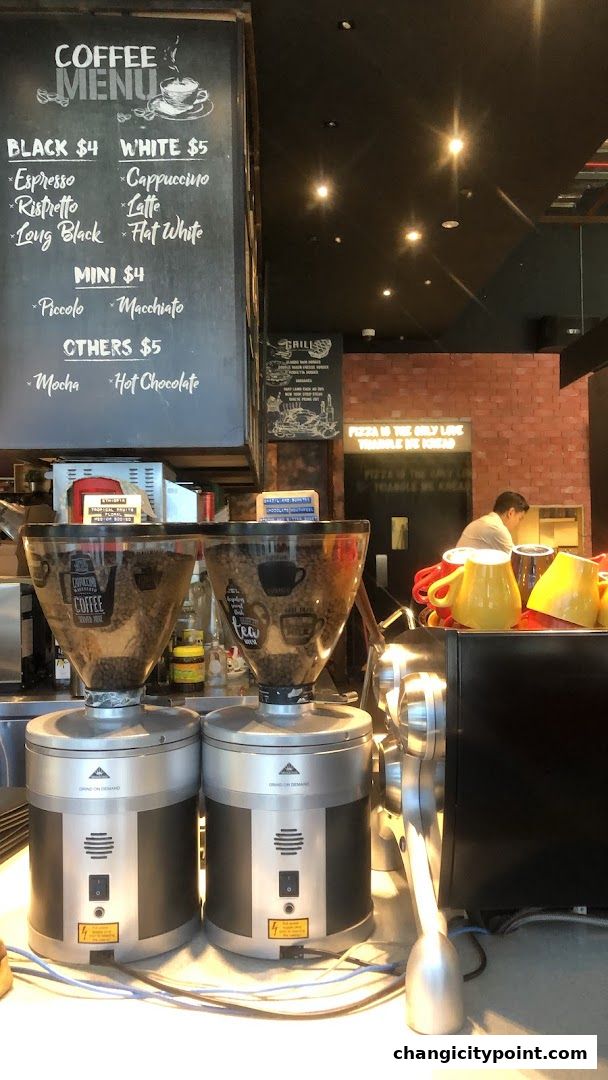 A coffee menu board with various espresso drinks and prices.