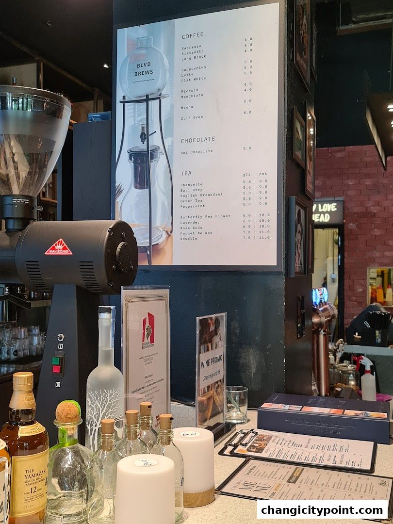 A menu board displays coffee, chocolate, and tea options at BLVD Brews.