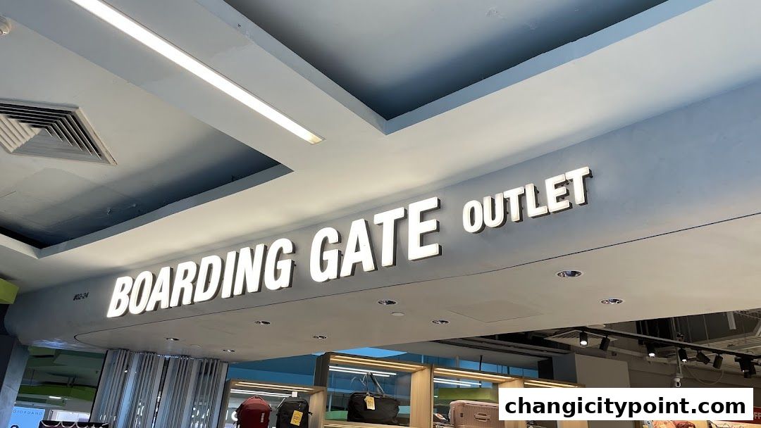 The illuminated sign for 'BOARDING GATE OUTLET' above a display of luggage.