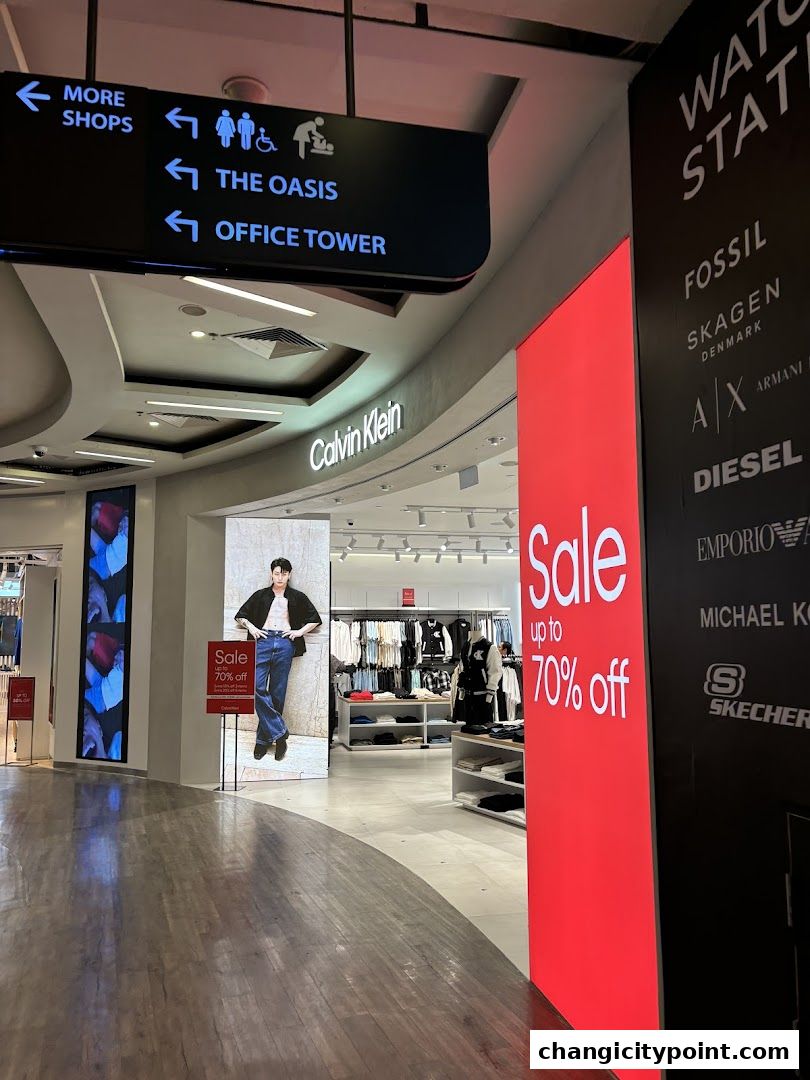 Calvin Klein store entrance with a large sale banner and fashion display.