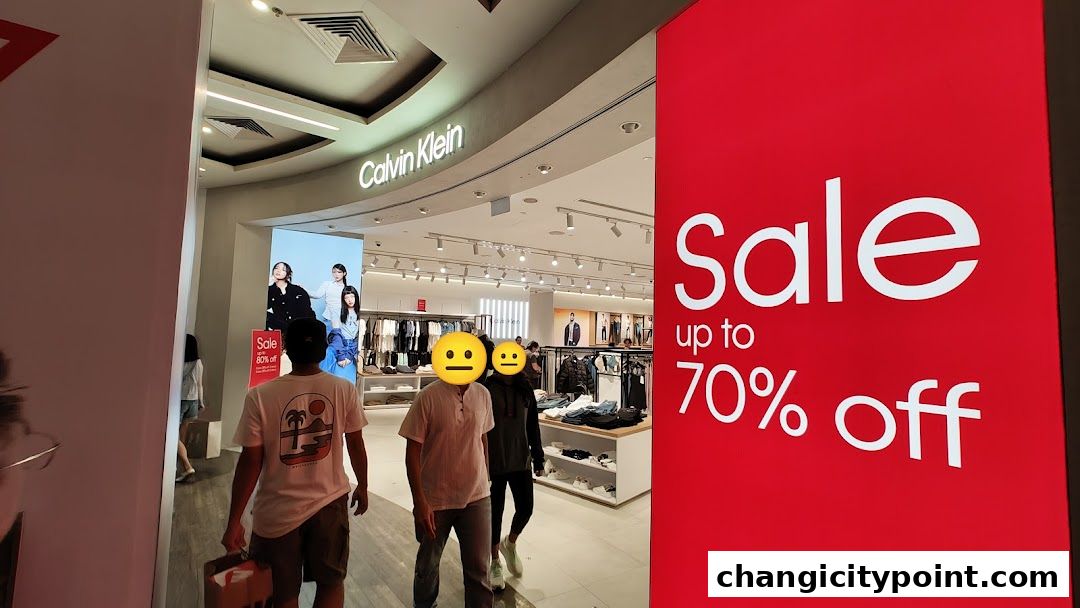 Calvin Klein store entrance with a large red sale banner advertising up to 70% off.