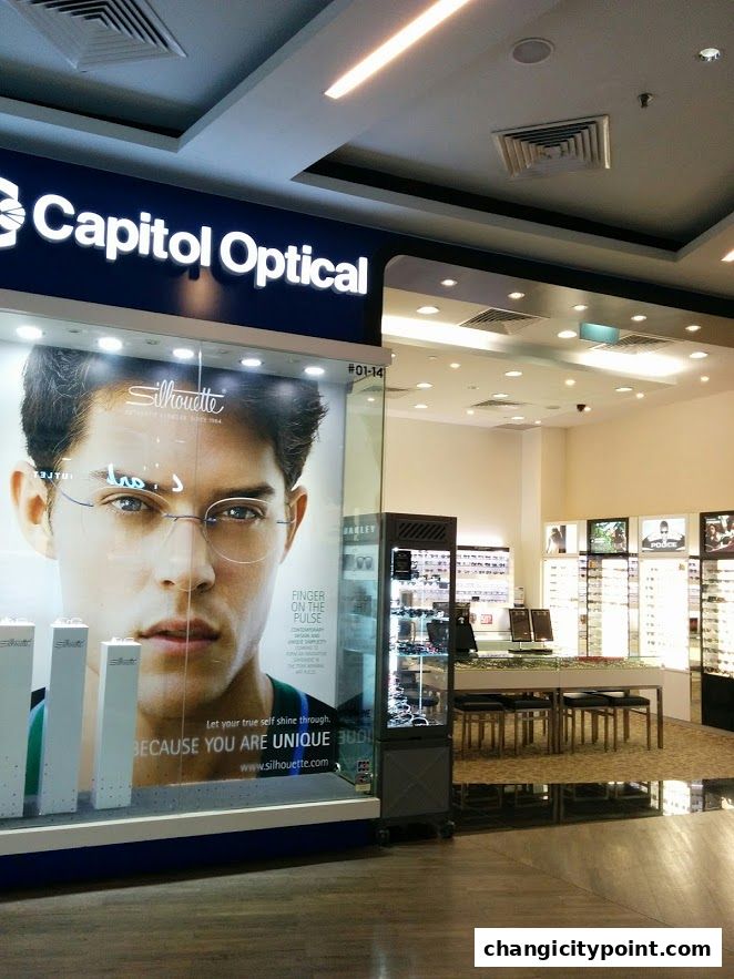 Capitol Optical shop front with a large display of eyewear and a prominent Silhouette advertisement.