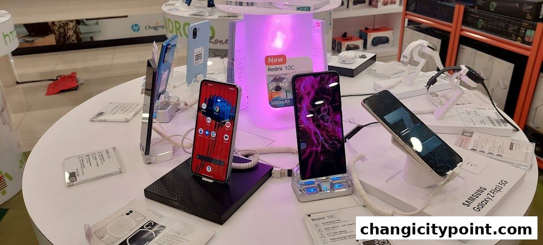 A display of various smartphones and smartwatches at a retail electronics store.