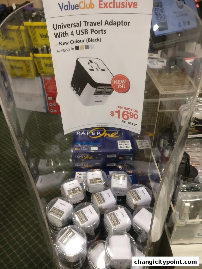 A display of universal travel adaptors with USB ports on promotion.