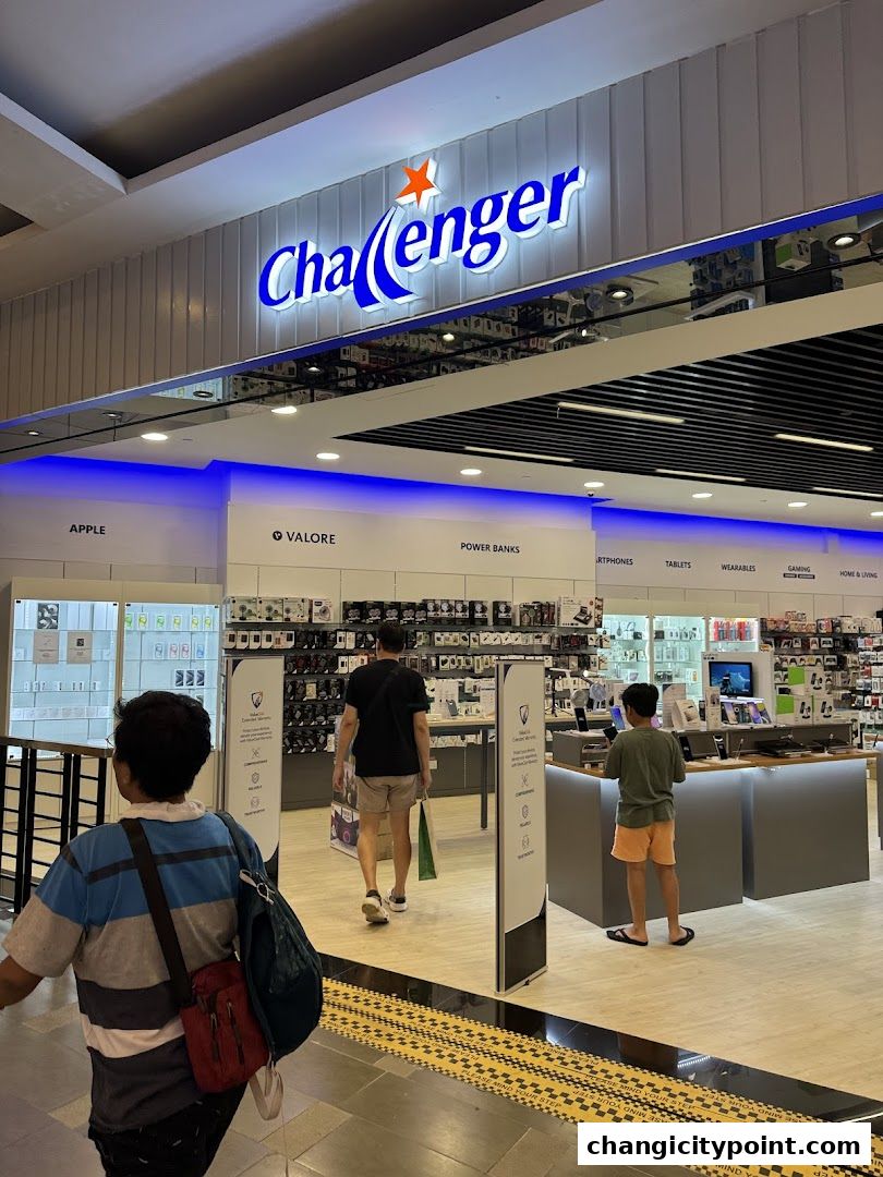 The entrance to Challenger electronics store with various gadgets and accessories displayed.