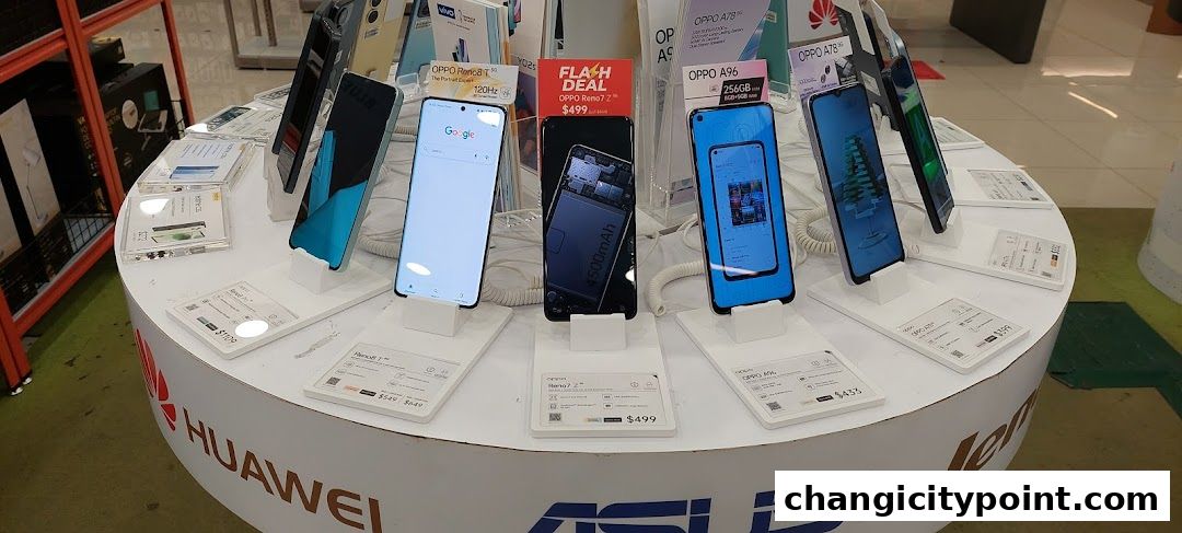A display of various smartphones from brands like Huawei, Oppo, and Asus.