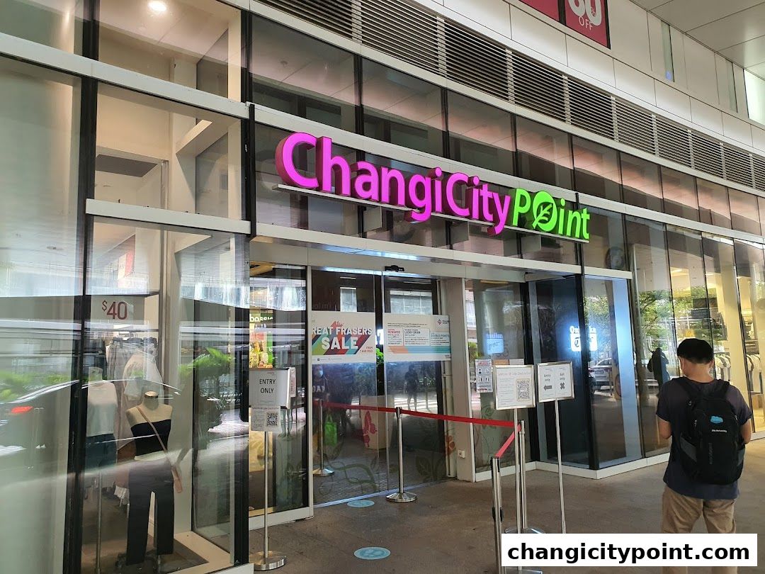 The entrance of Changi City Point with a sale sign and mannequins in the window.