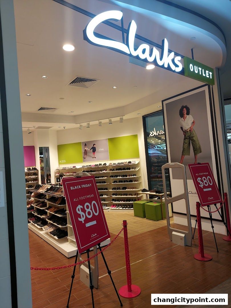 Clarks Outlet shoe store with Black Friday sale signs and displays of footwear.
