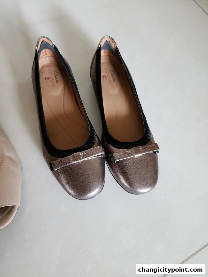 A pair of metallic bronze ballet flats with a bow detail from Clarks.