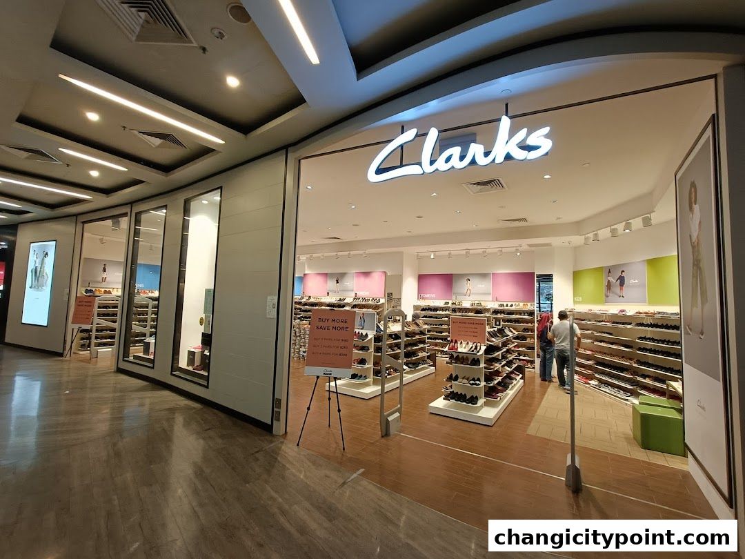 The entrance of a Clarks Outlet shoe store, showcasing a wide selection of footwear.