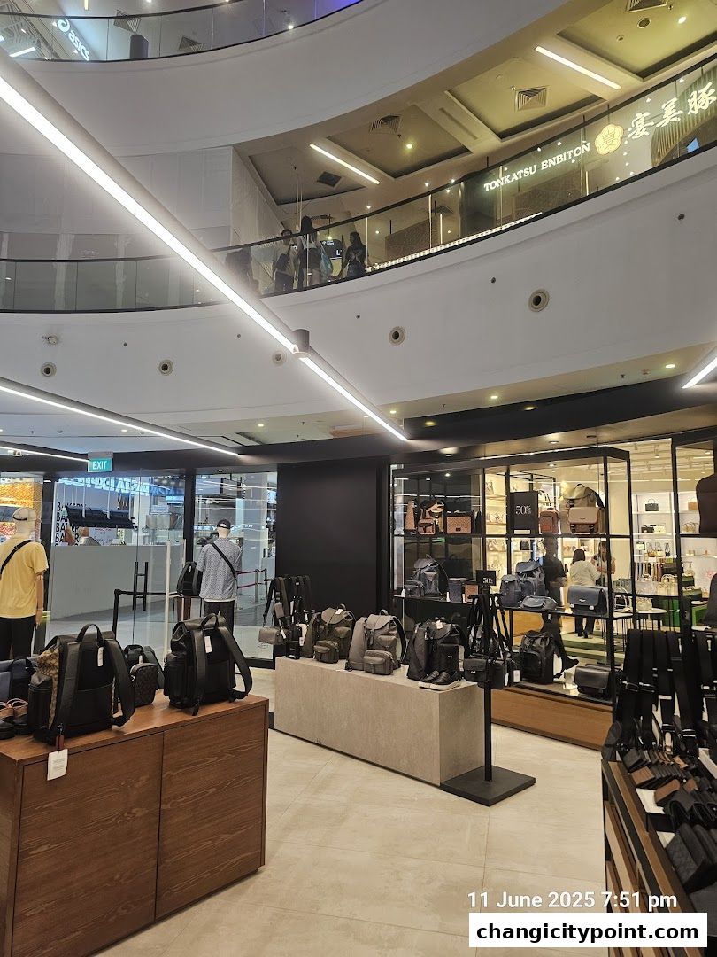 Interior view of a Coach Outlet store showcasing various bags and accessories.
