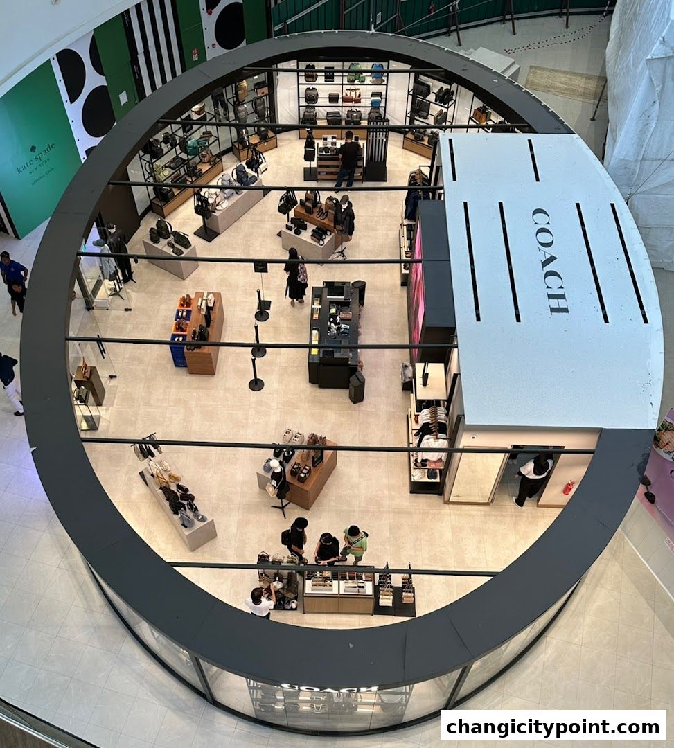 Overhead view of a Coach Outlet store showcasing handbags and accessories.