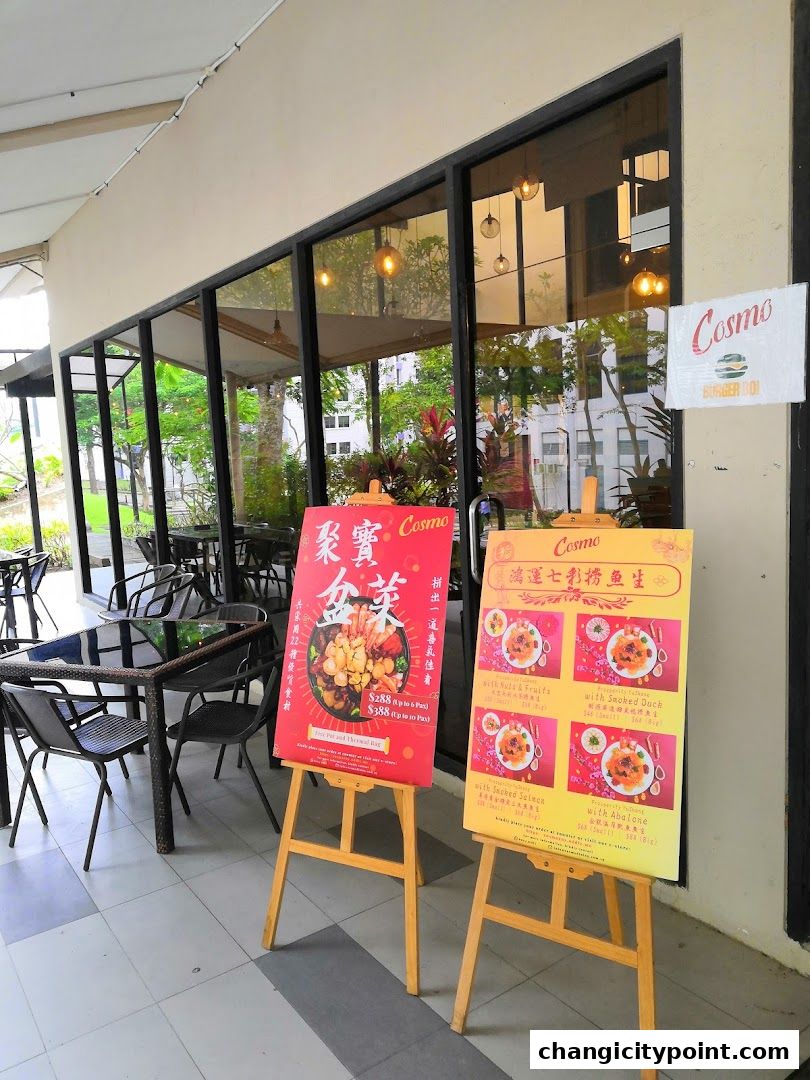 Restaurant entrance with two display boards showing food items and prices.