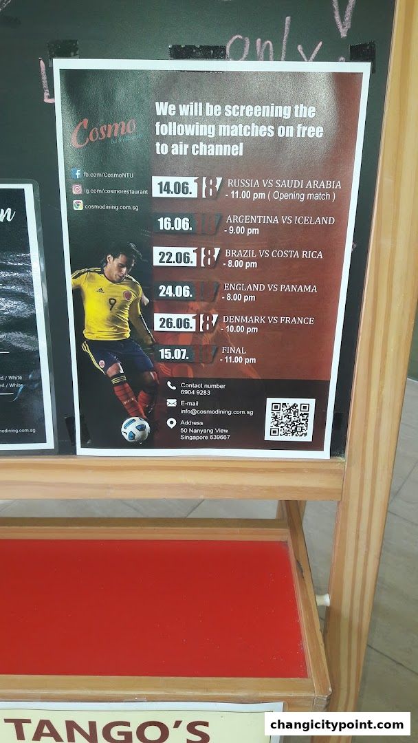 A poster advertises football matches being screened at Cosmo Restaurant, Dorsett Changi City, Singapore.