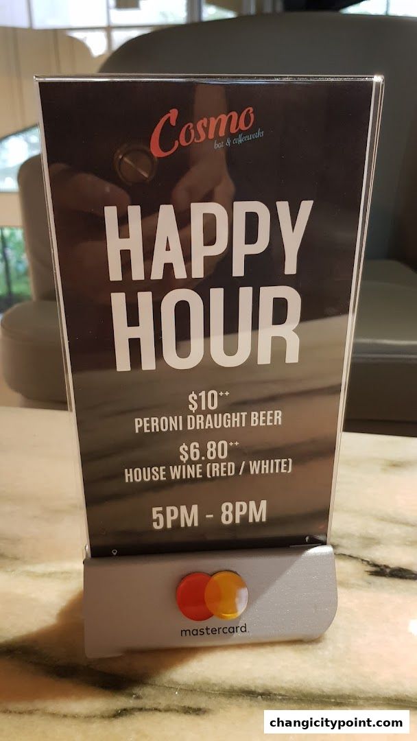 A sign advertising Cosmo bar & coffeeworks' happy hour deals on beer and wine.