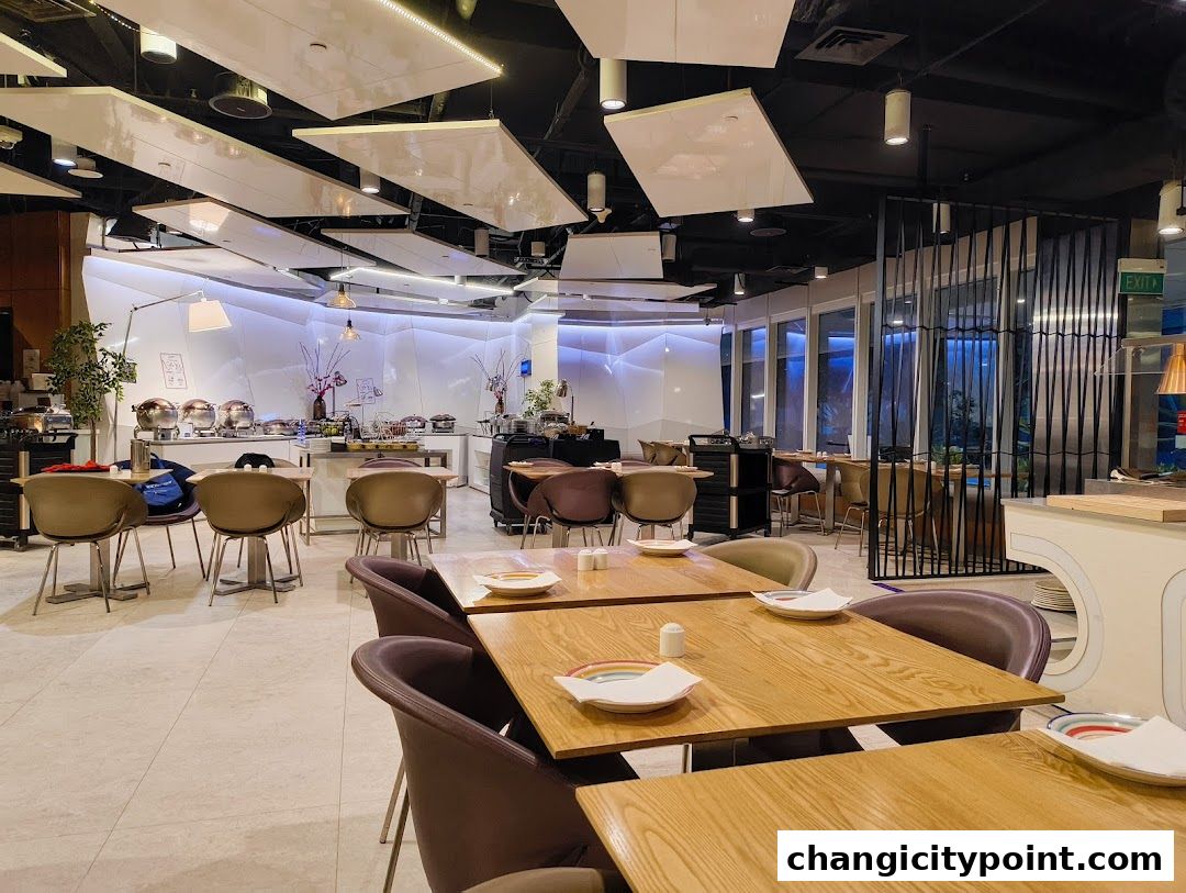 Interior view of a modern restaurant with buffet stations and dining tables.
