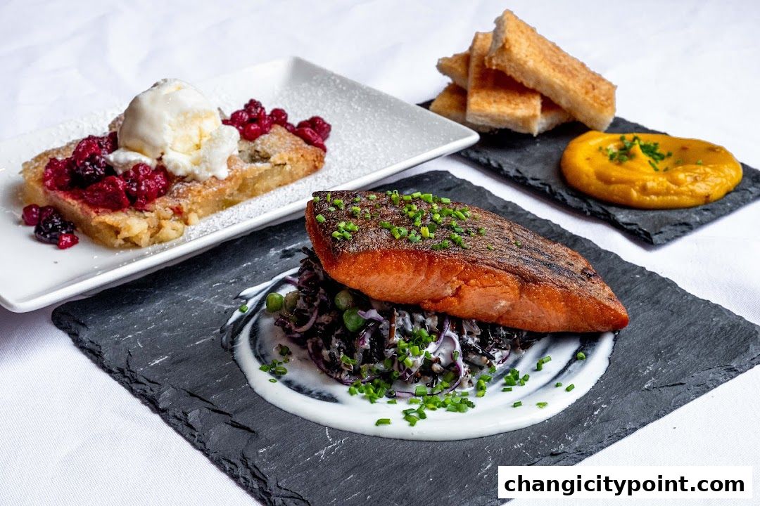 A beautifully plated salmon dish with sides and a dessert with ice cream.