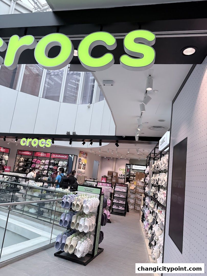 The entrance and interior of a Crocs Outlet store displaying various footwear.