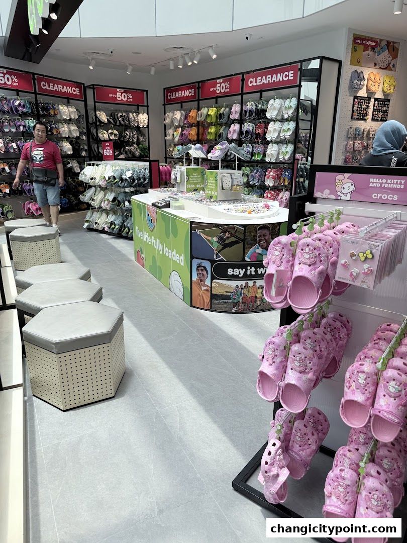 Interior of a Crocs outlet store showcasing clearance items and Hello Kitty themed footwear.