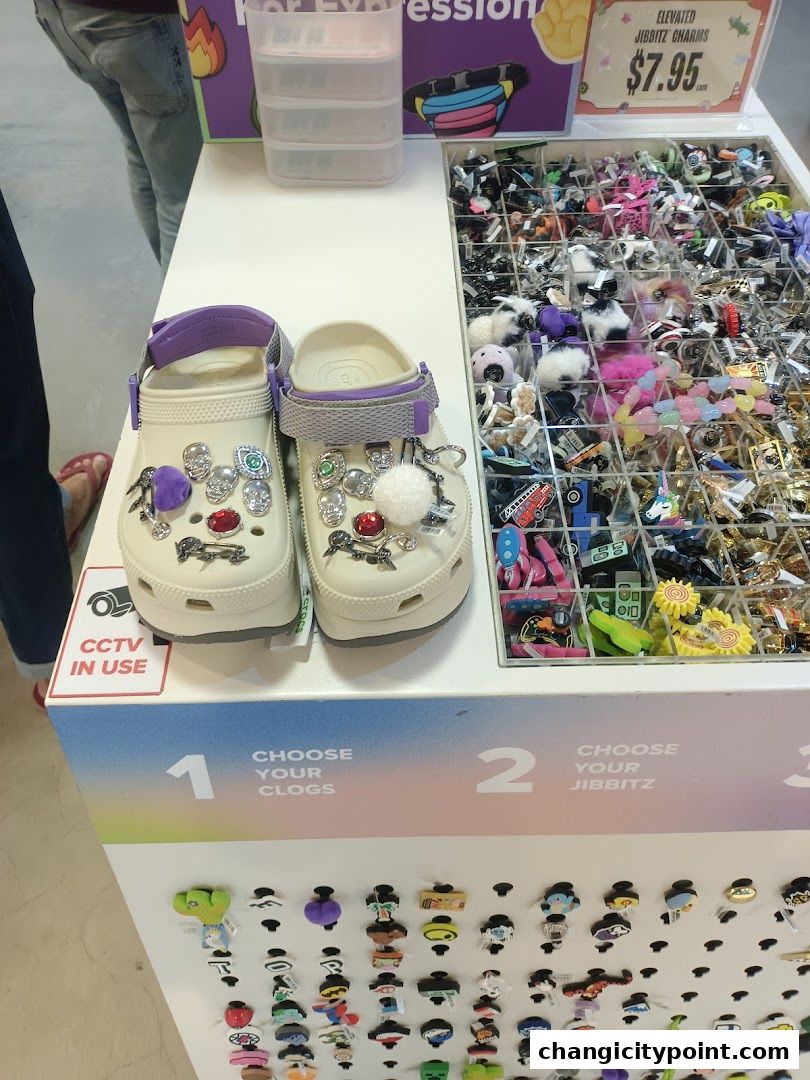Crocs shoes displayed with a variety of Jibbitz charms for customization.