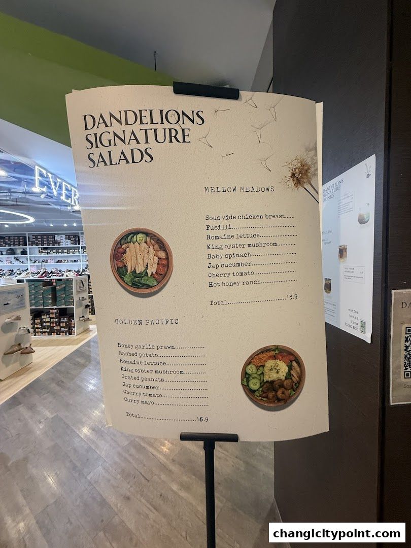 A menu board displaying Dandelions' signature salads with ingredients and prices.