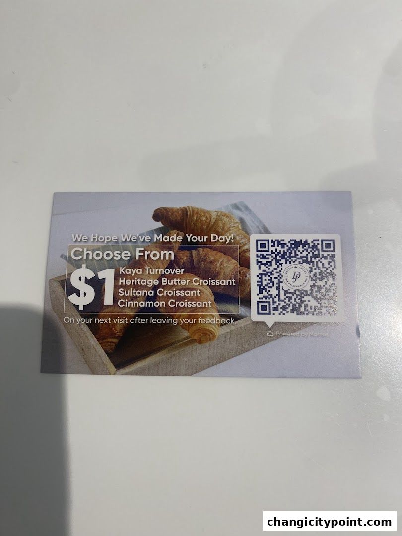 A promotional card offering croissants for $1 from Delifrance.