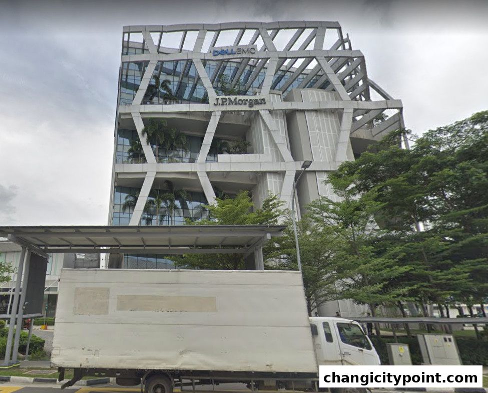 Modern office building with Dell Technologies and J.P. Morgan signage, featuring a white truck in the foreground.
