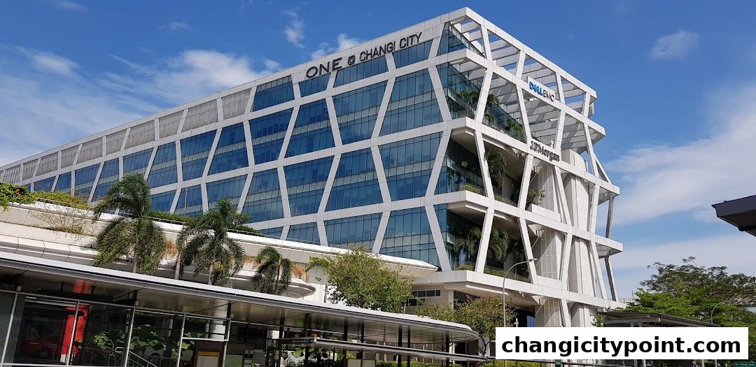 Modern office building with geometric facade, featuring Dell Technologies and J.P. Morgan signage.