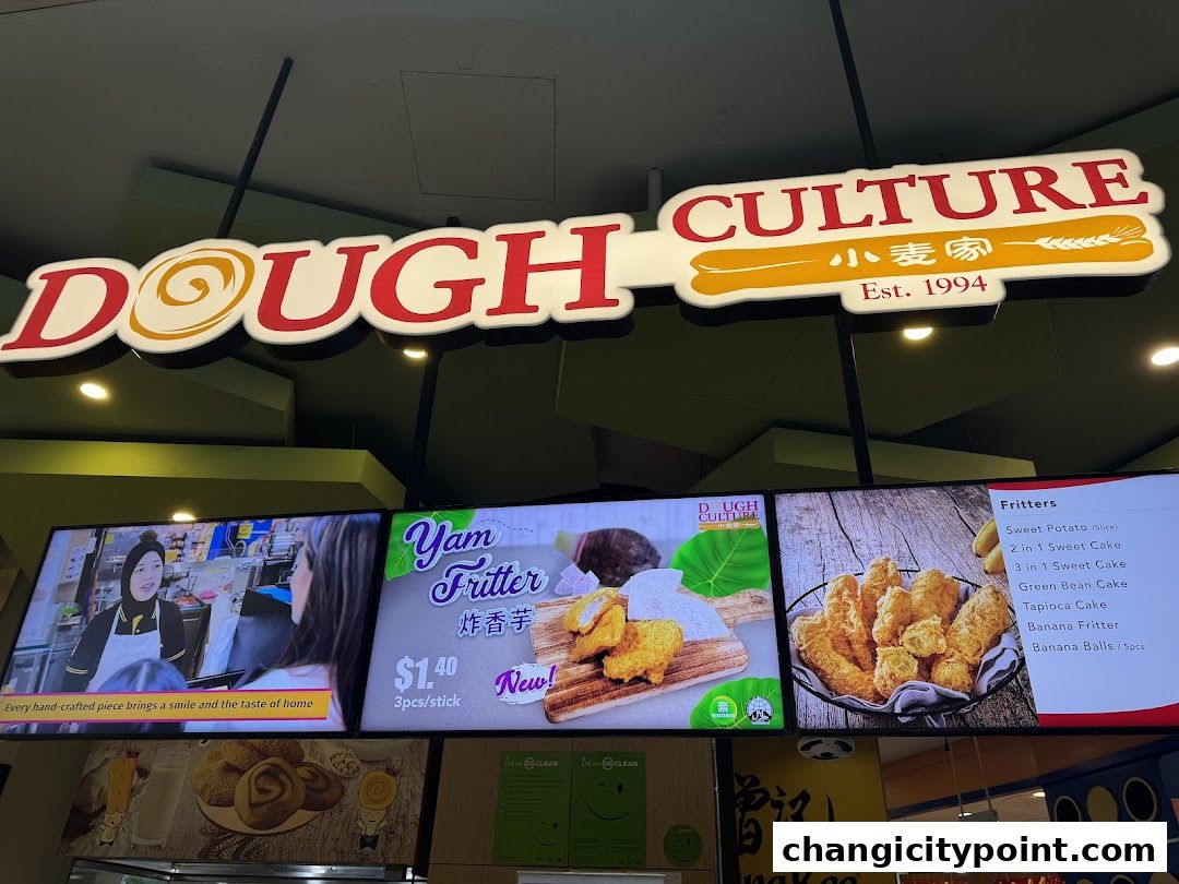Digital menu boards displaying food items and prices for Dough Culture.